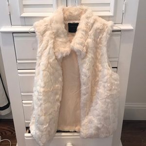 White fur vest